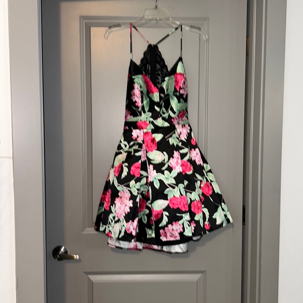 Woman’s dress size 9. Spaghetti strap, zipper lace back with zipper waist bottom